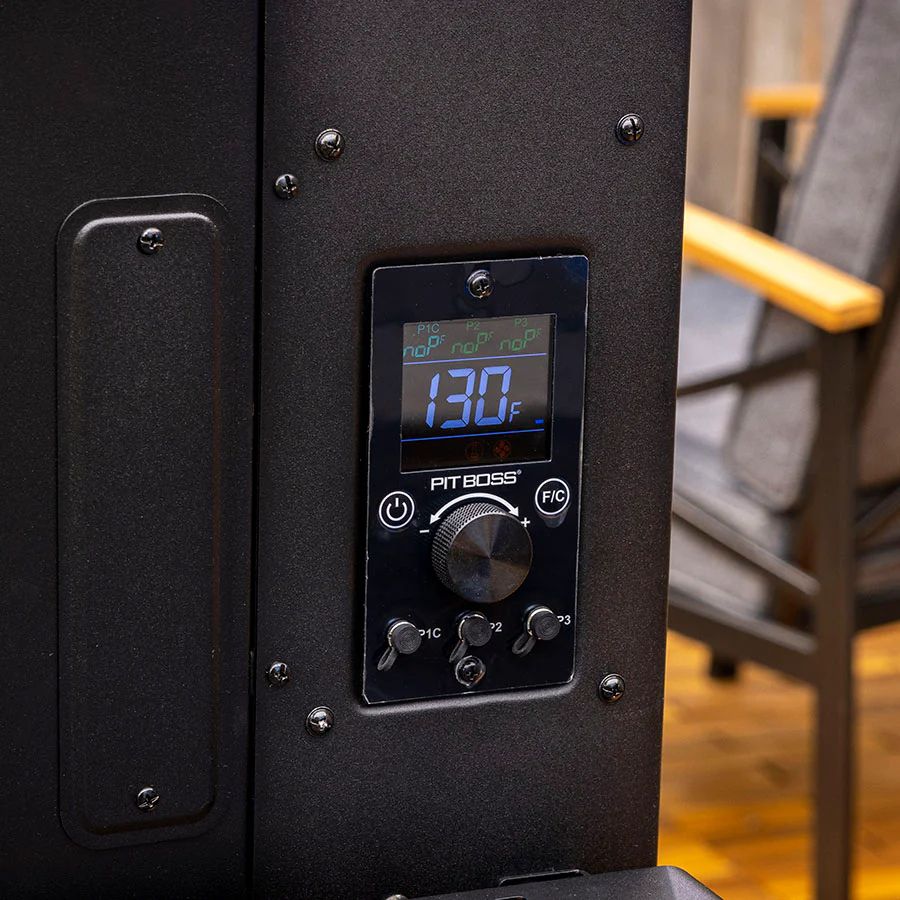 Close-up of the digital temperature control panel on the Pit Boss Navigator 6 Series Smoker set to 130°F.