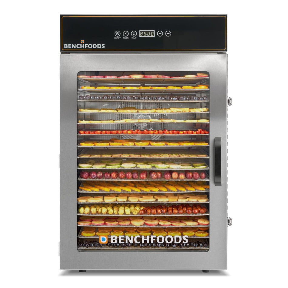 Straight-on front view of a single-zone BenchFoods 16-tray commercial dehydrator filled to capacity with colorful rows of sliced fruits on stainless steel mesh trays.