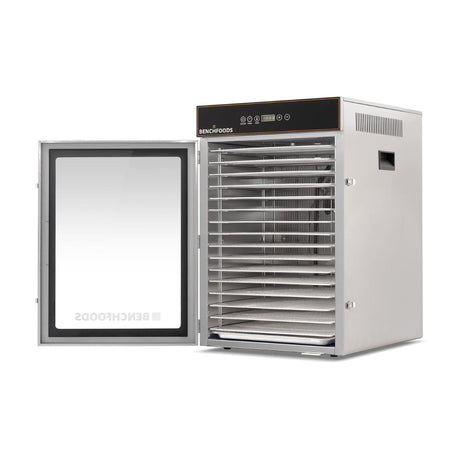 Commercial BenchFoods 16-tray dehydrator with an open glass door, highlighting the spacing of empty stainless steel commercial kitchen racks and internal depth.