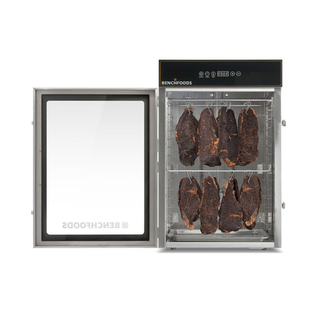 BenchFoods 16CUDG commercial biltong dehydrator with glass door open, showcasing the traditional internal multi-rail hanging racks and heavy-duty meat hooks.