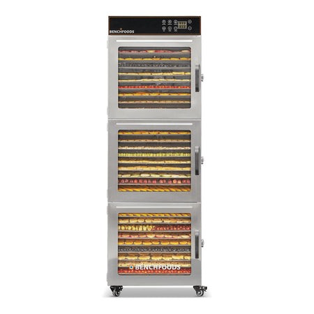 BenchFoods 30CUDG commercial dehydrator front view with closed doors showing dehydrated fruit trays loaded in all three zones