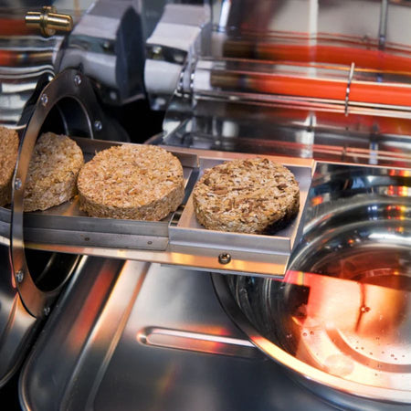 Close-up of wood bisquettes in the Bradley Digital 4-Rack Electric Smoker