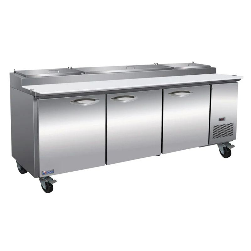 IKON IPP94 94-inch refrigerated pizza prep table with three stainless steel doors, topping rail, and full-width cutting board