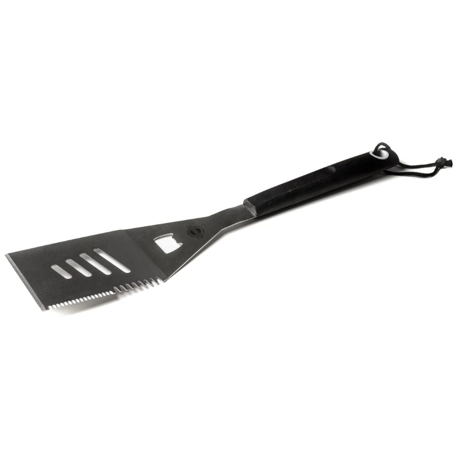 Angled view of Jackson Grills stainless steel grill flipper with serrated edge and bottle opener