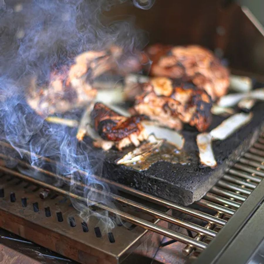 Jackson Grills Smoker Box in use producing smoke under grillstone