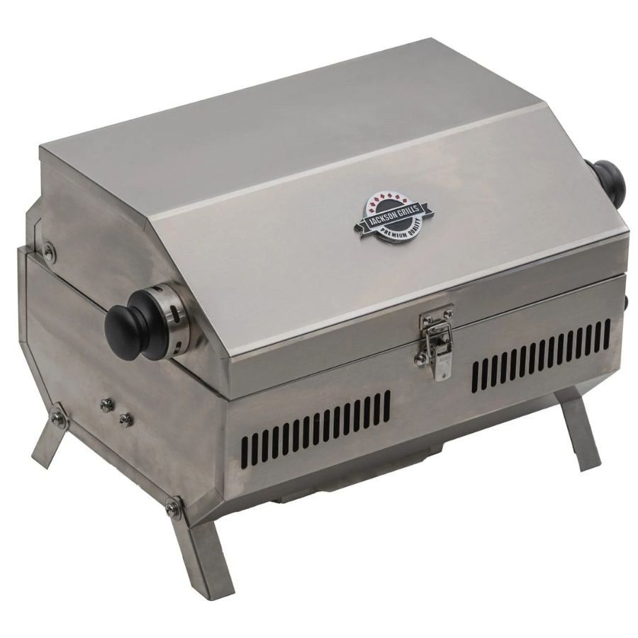 Rear-left angled view of the Jackson Grills VERSA 50 portable grill with folded legs