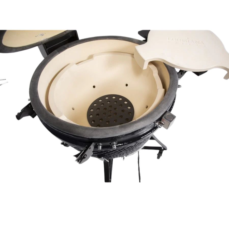 Interior view of the Louisiana Grills 24" Ceramic Kamado Charcoal Grill, showcasing its high-heat ceramic walls and adjustable airflow system.