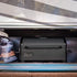 Louisiana Grills 300 Black Label Portable Wood Pellet Grill neatly stored in an RV compartment, demonstrating its compact and travel-friendly design for outdoor adventures.