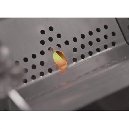A close-up of the Louisiana Grills Rapid Igniter Kit with a glowing tip