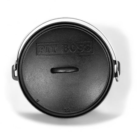 Pit Boss 12-inch Cast Iron Dutch Oven with its lid, angled view showing the sturdy handle