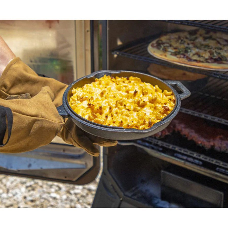 Angled view of the Pit Boss 12-inch Cast Iron Deep Skillet with the lid slightly ajar