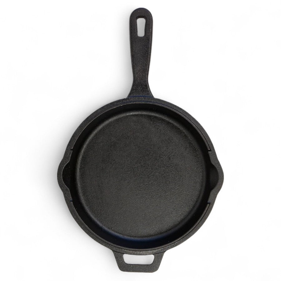 The bottom of the Pit Boss 12-inch Cast Iron Deep Skillet's lid, showing a ridged, griddle-like surface