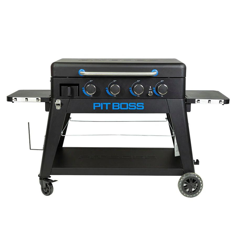 Front view of the Pit Boss 4-Burner Ultimate Lift-Off Griddle with side shelves and propane tank space.