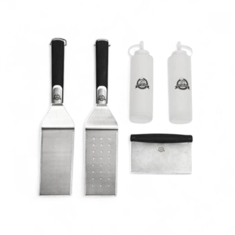 A Pit Boss Soft Touch 5-Piece Griddle Accessories Kit, including two spatulas, a griddle scraper, a cleaning brush, and a squeeze bottle