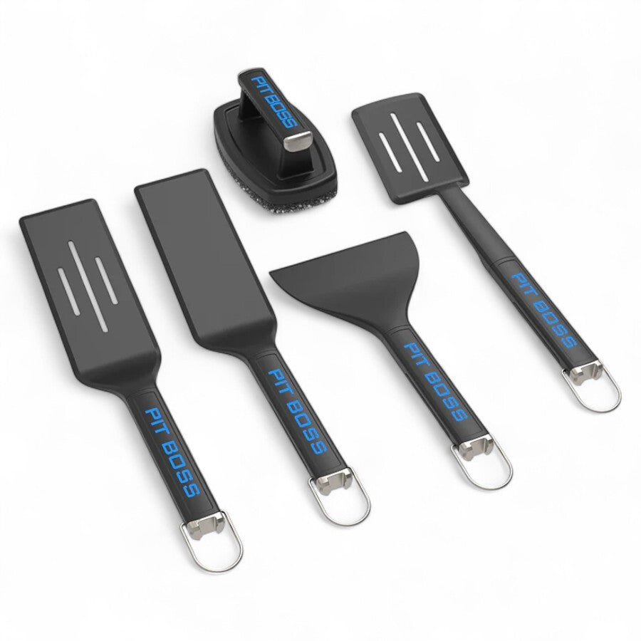 Pit Boss 5-piece Ultimate Griddle Kit, featuring a griddle press, two spatulas, a scraper, and a griddle brush, all in black with blue accents