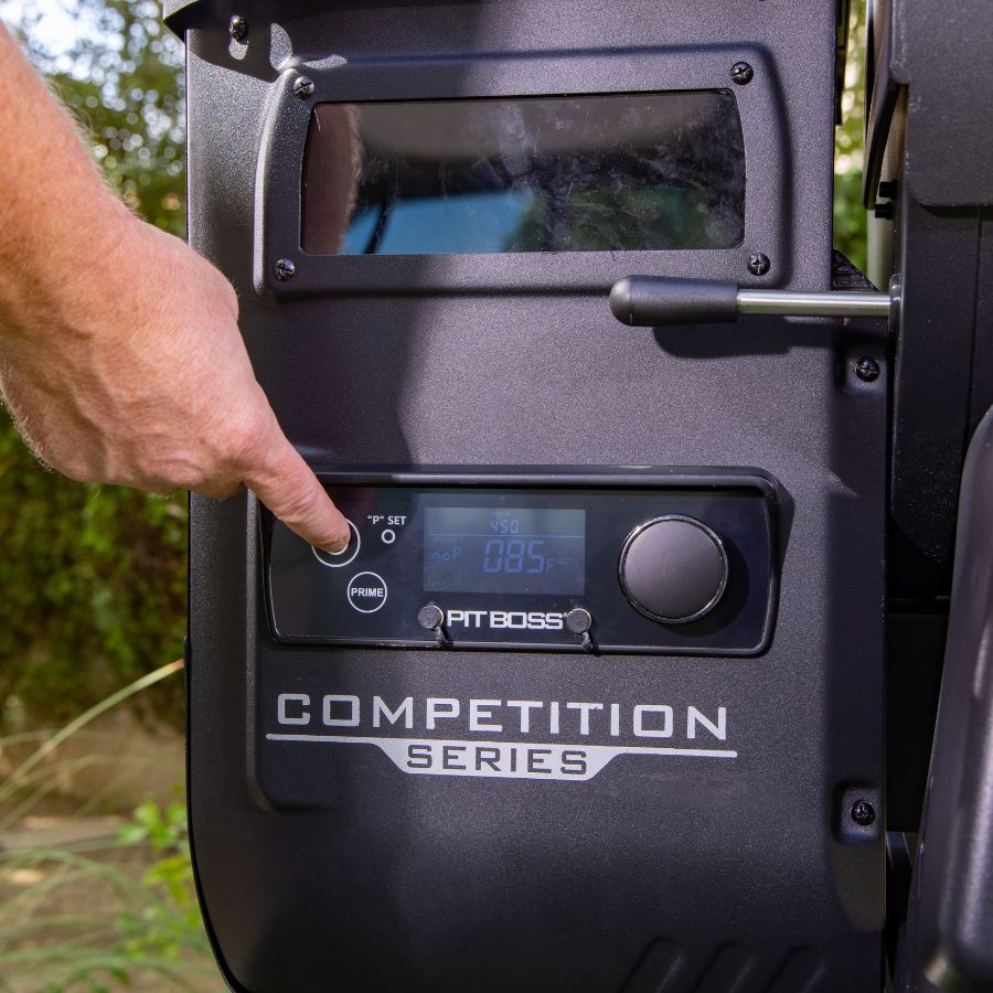 Close-up of the Pit Boss Competition Series 1250 digital control panel, featuring temperature settings, LED display, and Prime button for enhanced grilling control.