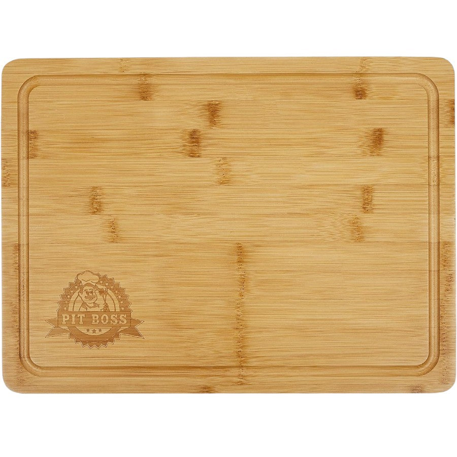 A rectangular Pit Boss cutting board made of wood, featuring a prominent magnetic side for tool