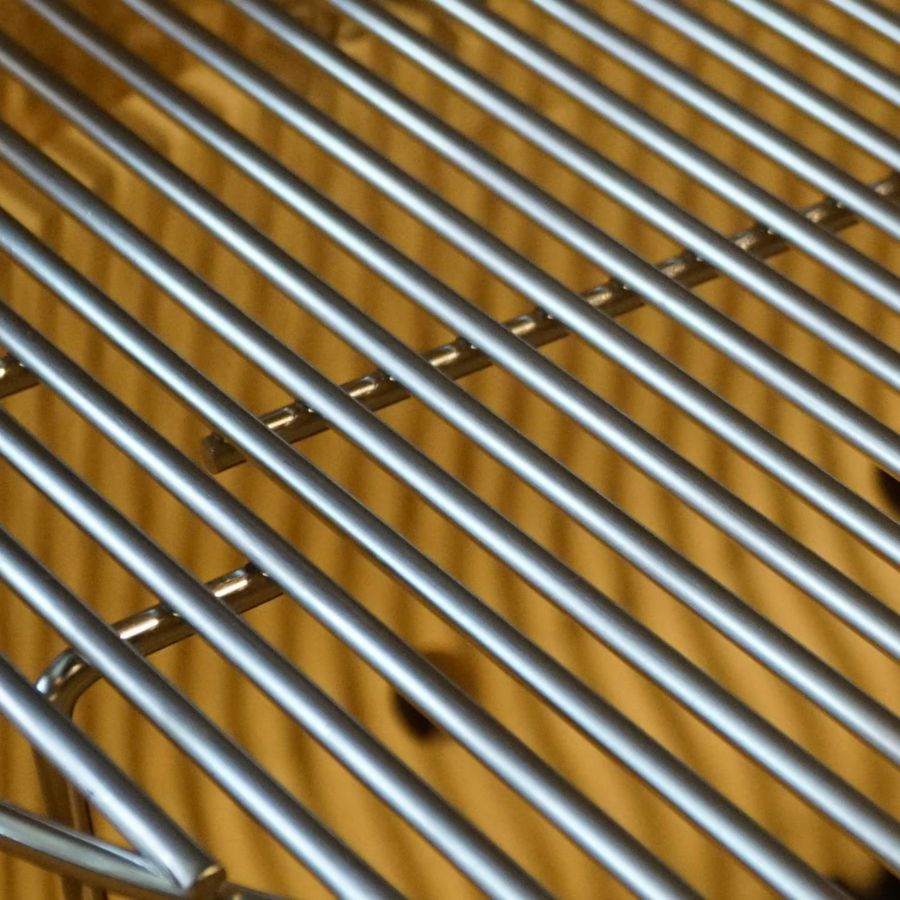 Close-up of stainless steel cooking grates in the Primo Oval X-Large Kamado Grill