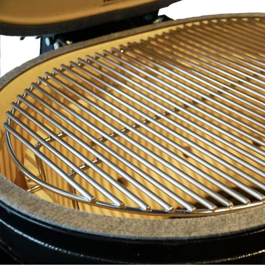 Interior view showing the full cooking grate of Primo Oval X-Large All-in-one Grill