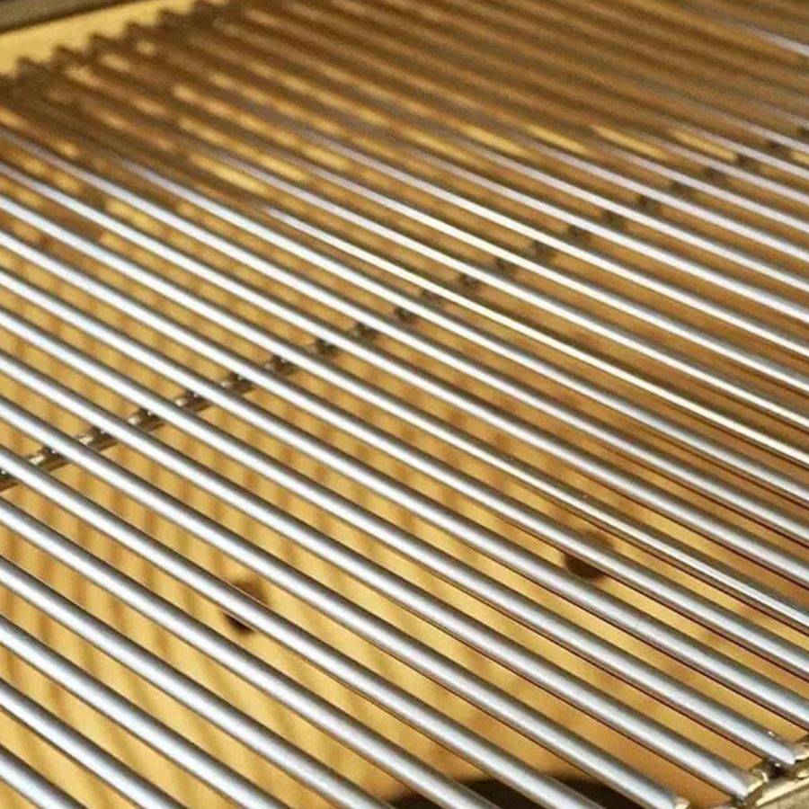 Close-up of stainless steel cooking grates inside Primo Round All-In-One