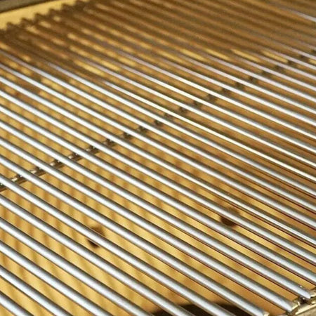 Close-up of stainless steel cooking grates inside Primo Round All-In-One